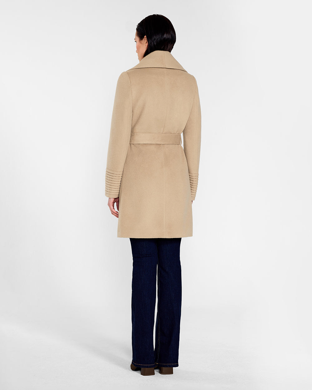 Sentaler Mid Length Shawl Collar Wrap Camel Coat in Baby Alpaca wool. Seen from back belted on female model.