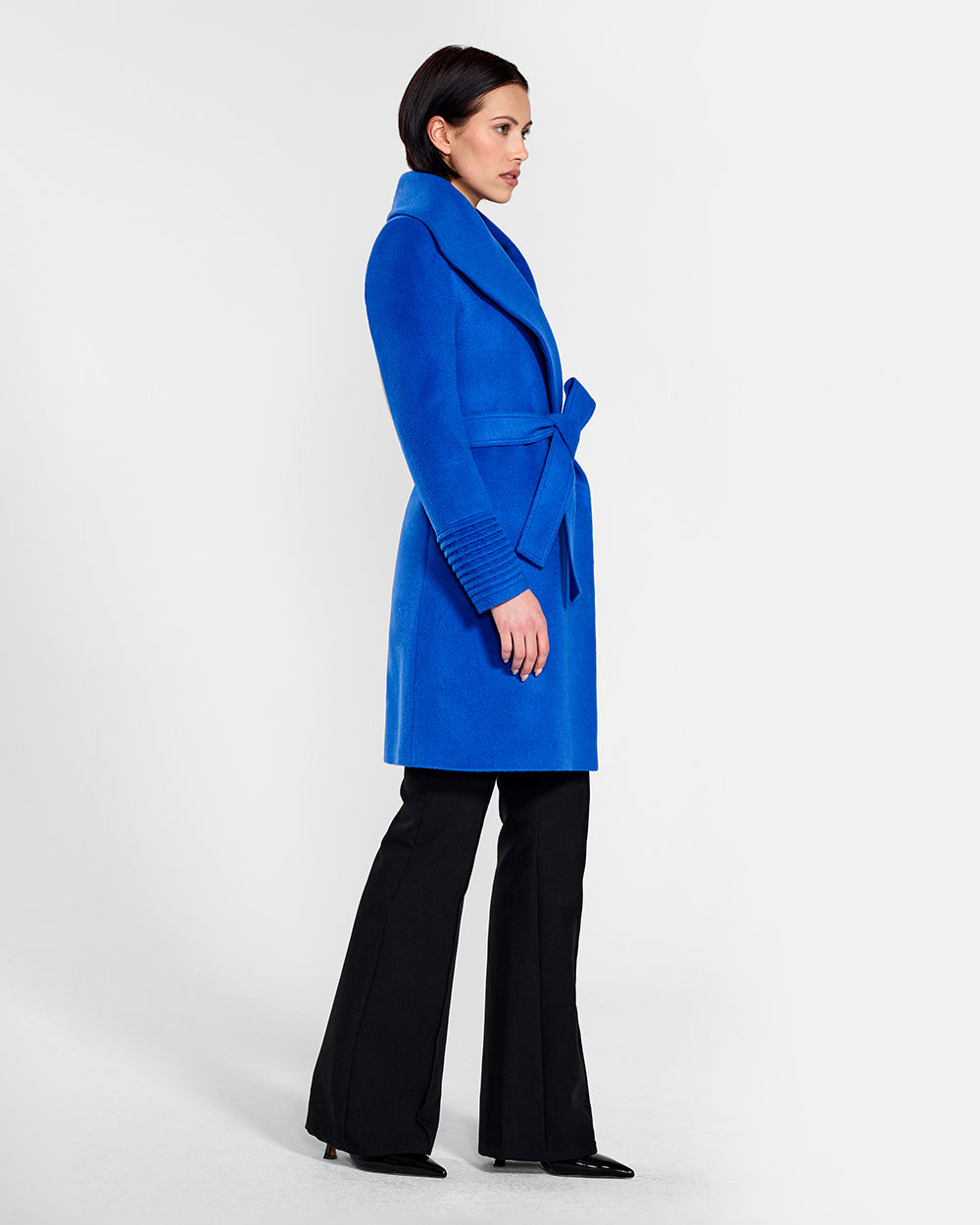 Sentaler Mid Length Shawl Collar Wrap Cobalt Blue Coat in Baby Alpaca wool. Seen from side belted on female model.