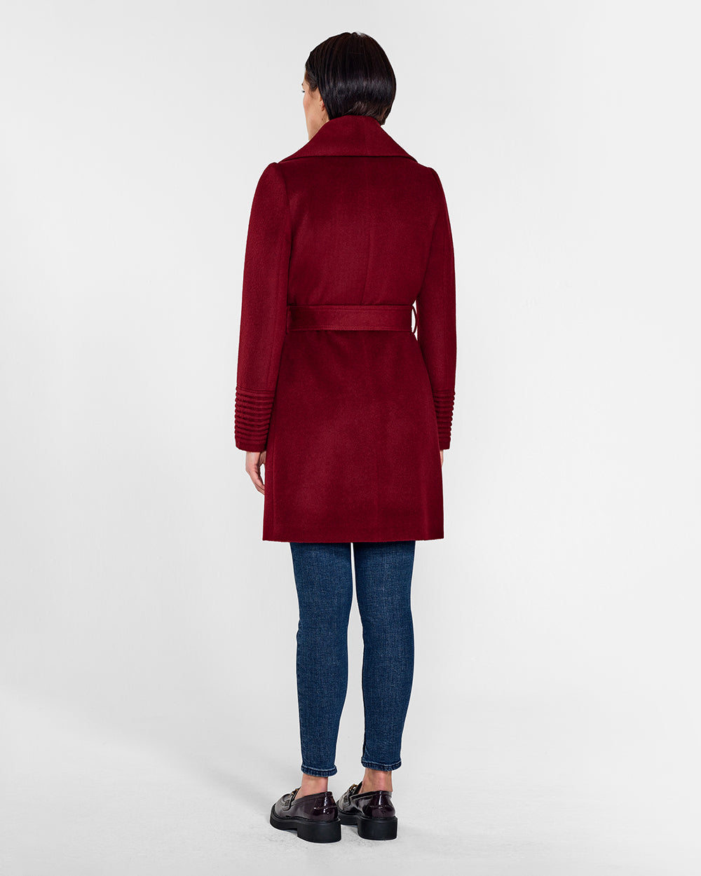 Sentaler Mid Length Shawl Collar Wrap Garnet Red Coat in Baby Alpaca wool. Seen from back belted on female model.