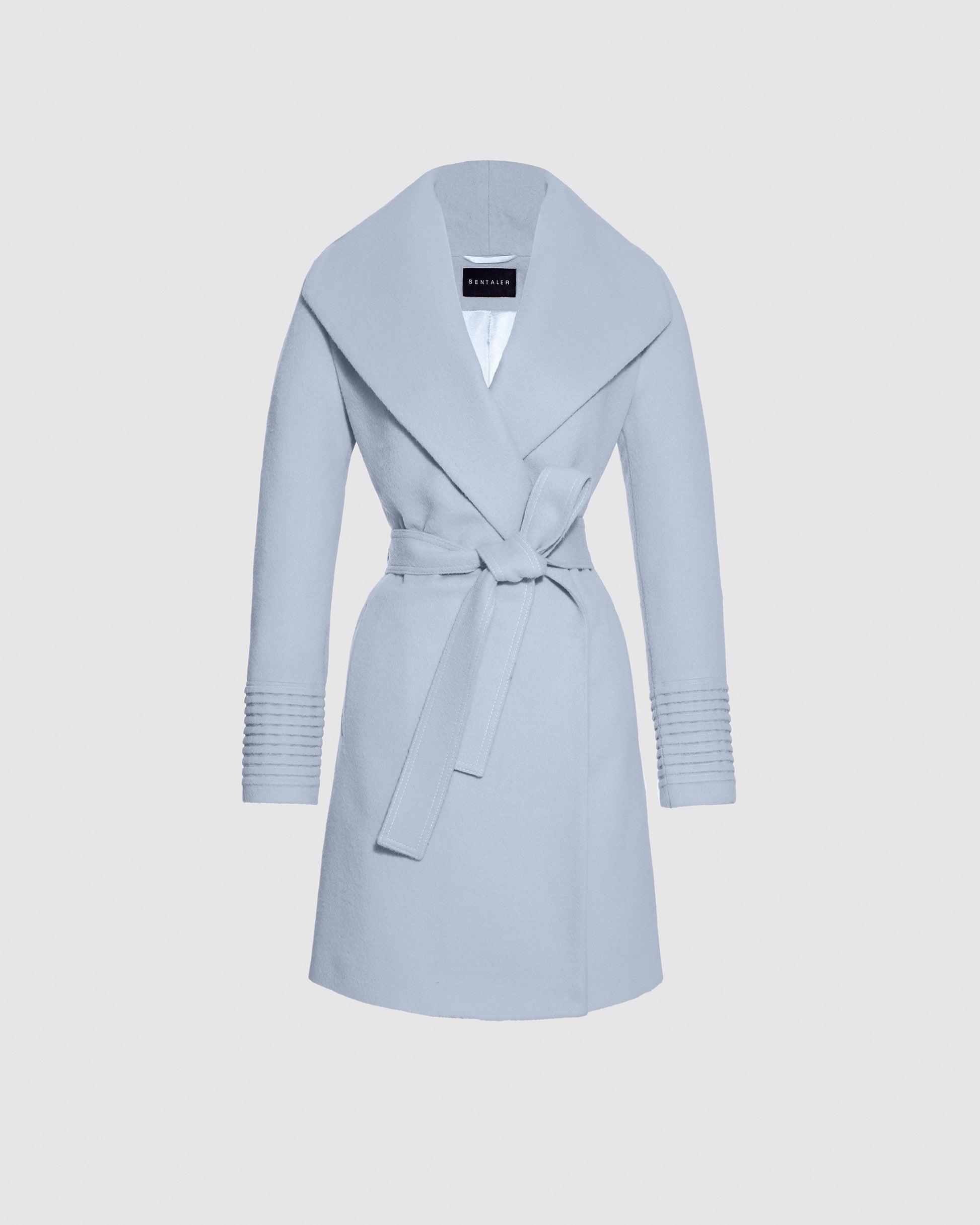 Sentaler mid length powder blue coat made of baby alpaca wool with a shawl collar, belted.