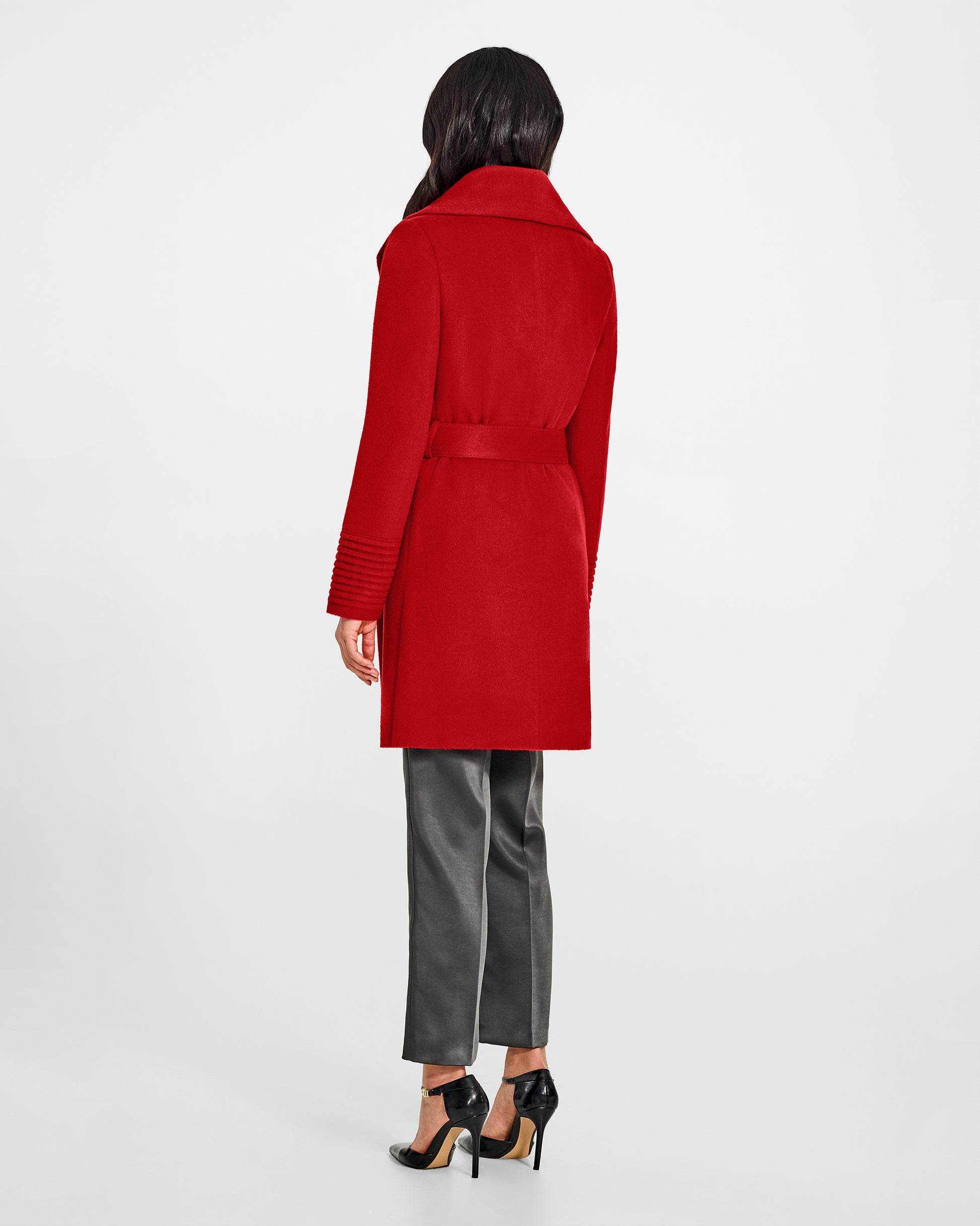 Back view of model wearing a Sentaler scarlet red long wrap coat made of baby alpaca wool, with a wide collar, worn belted.