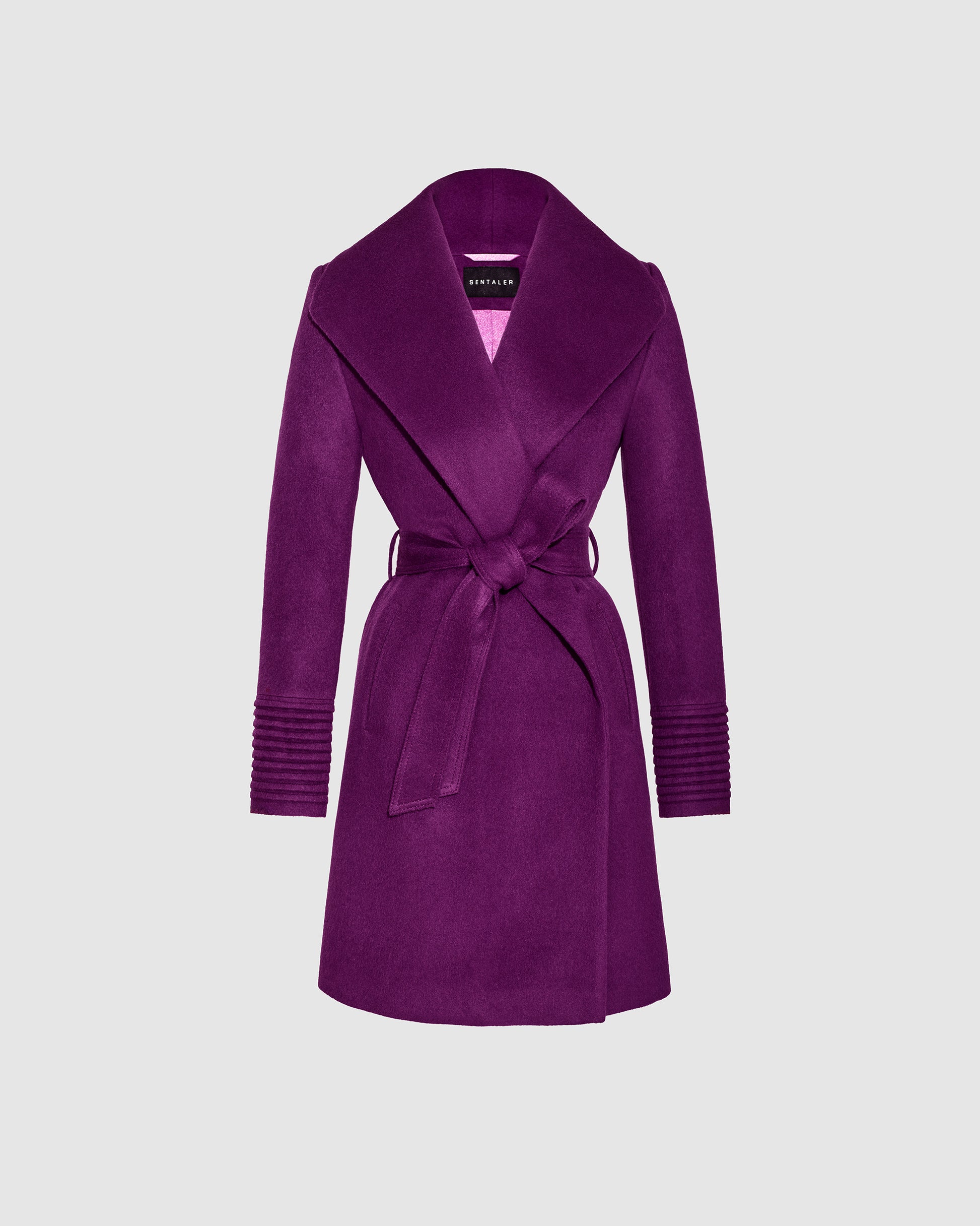 Sentaler mid length dark mulberry purple coat made of baby alpaca wool with a shawl collar, seen belted.