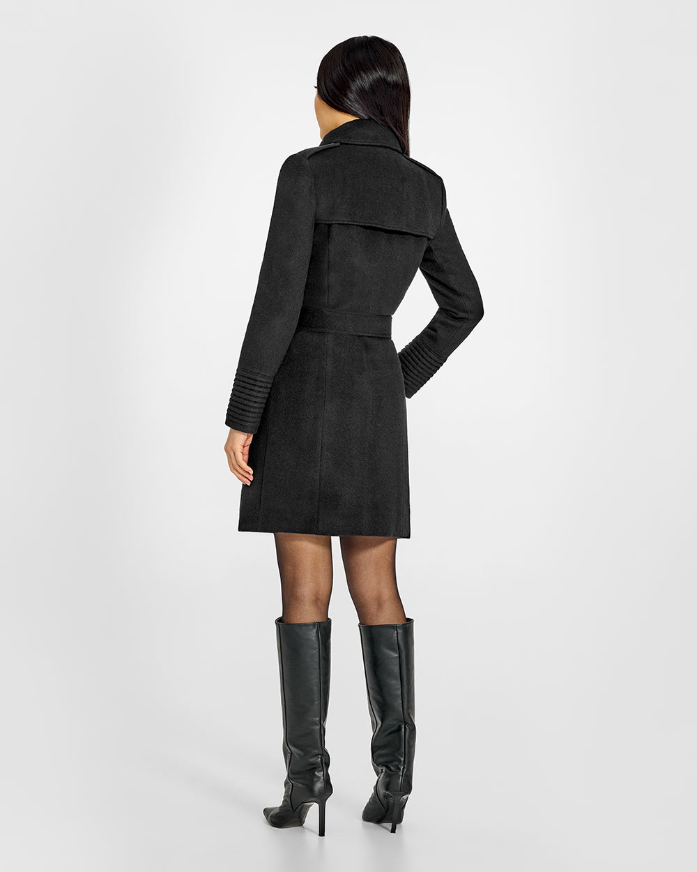 Sentaler Mid Length Trench Black Coat in Baby Alpaca wool. Seen from back belted on female model.