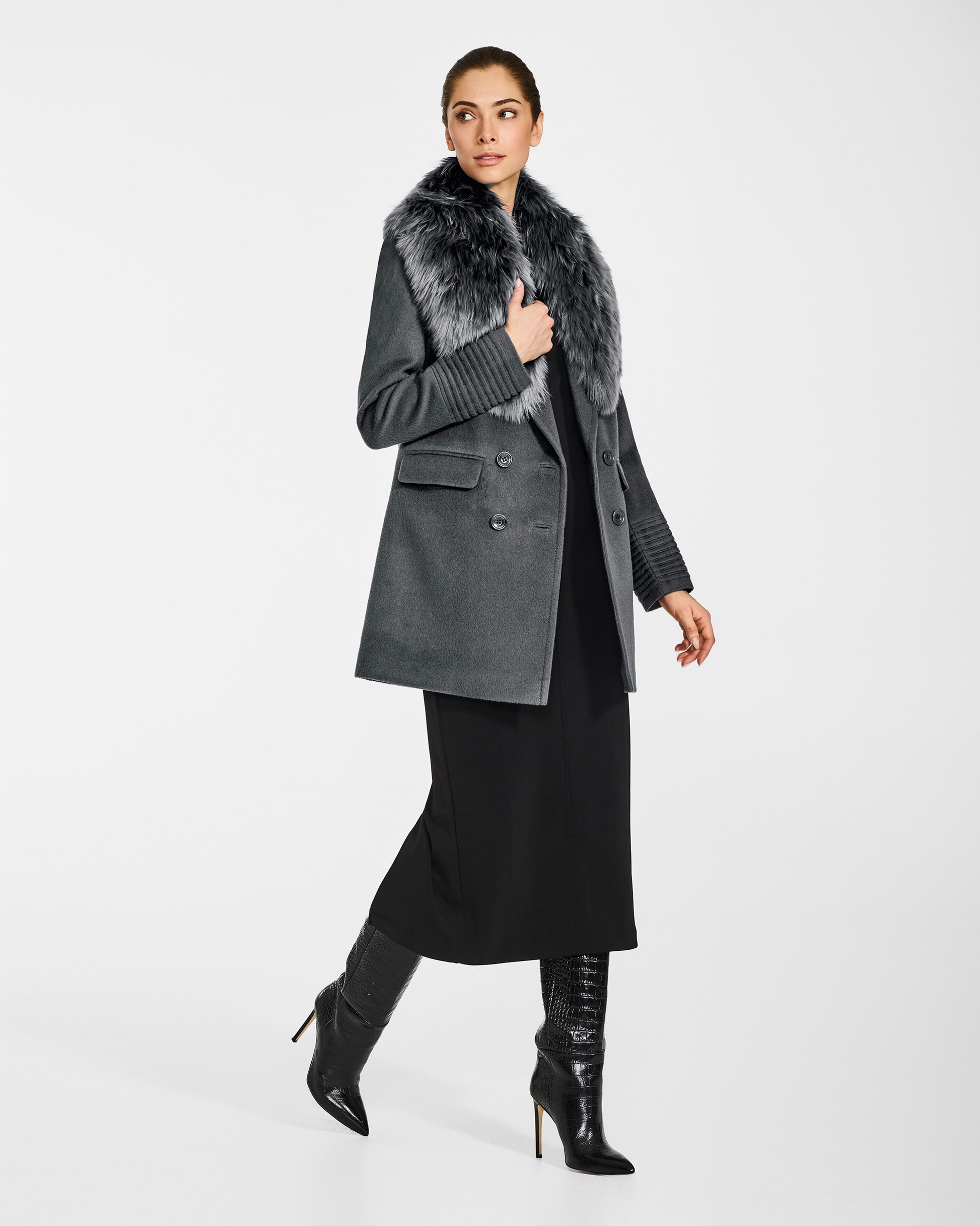 Side view of model wearing a Sentaler graphite grey topcoat made of baby alpaca wool with an alpaca shearling collar, open.