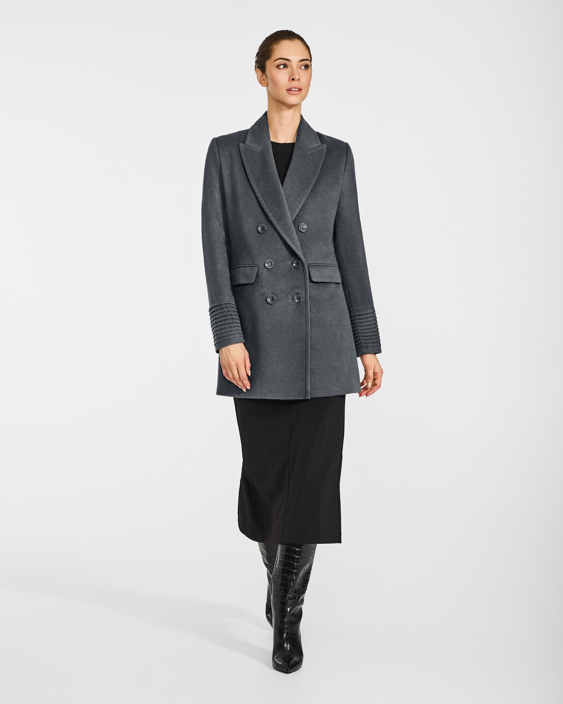 Front view of model in Sentaler graphite grey topcoat with peak collar in baby alpaca wool, buttoned.