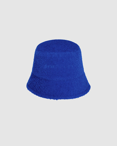 Sentaler Bouclé Alpaca Bucket Cobalt Blue Hat in Bouclé Alpaca wool. Seen as off figure.