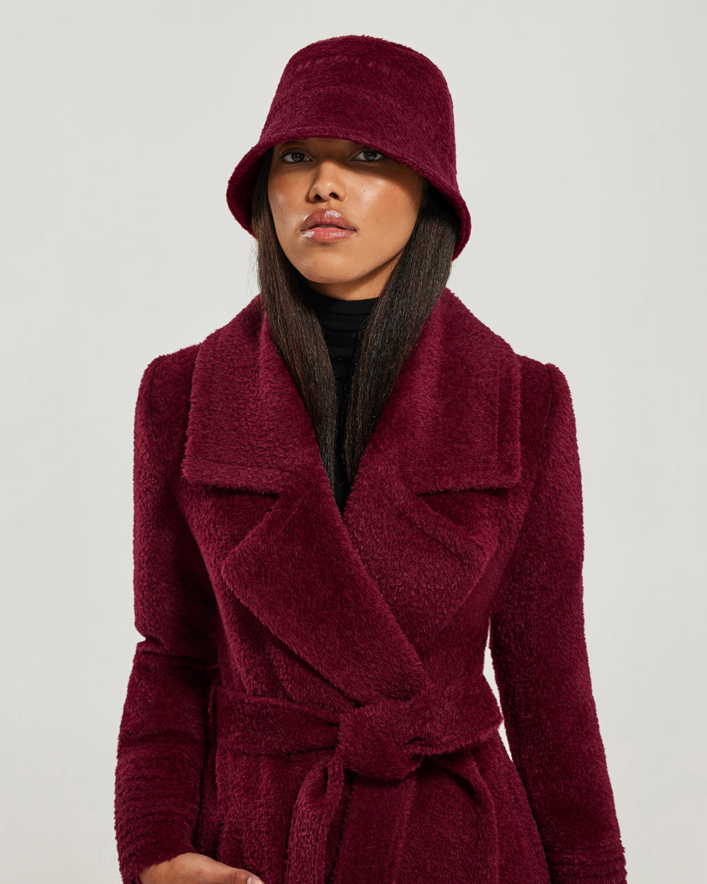 Sentaler Bouclé Alpaca Bucket Garnet Red Hat in Bouclé Alpaca wool. Seen from front close up on female model.