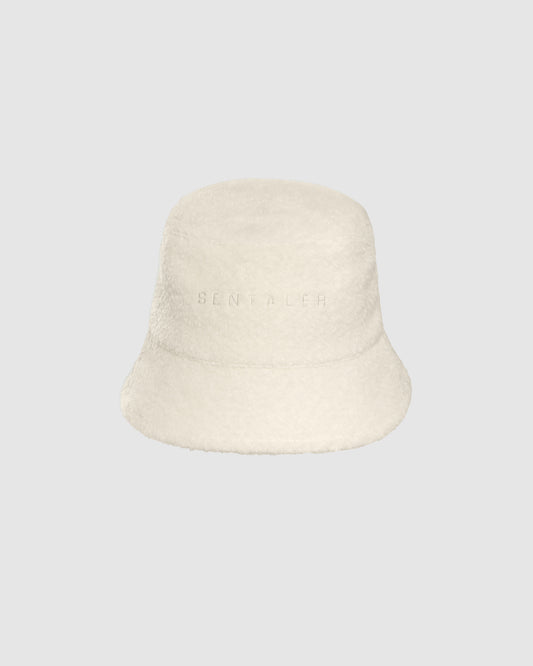Sentaler Bouclé Alpaca Bucket Ivory Hat in Bouclé Alpaca wool. Seen as off figure.