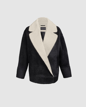 Sentaler black and white aviator jacket with dropped shoulders in bouclé alpaca wool, shown buttoned.