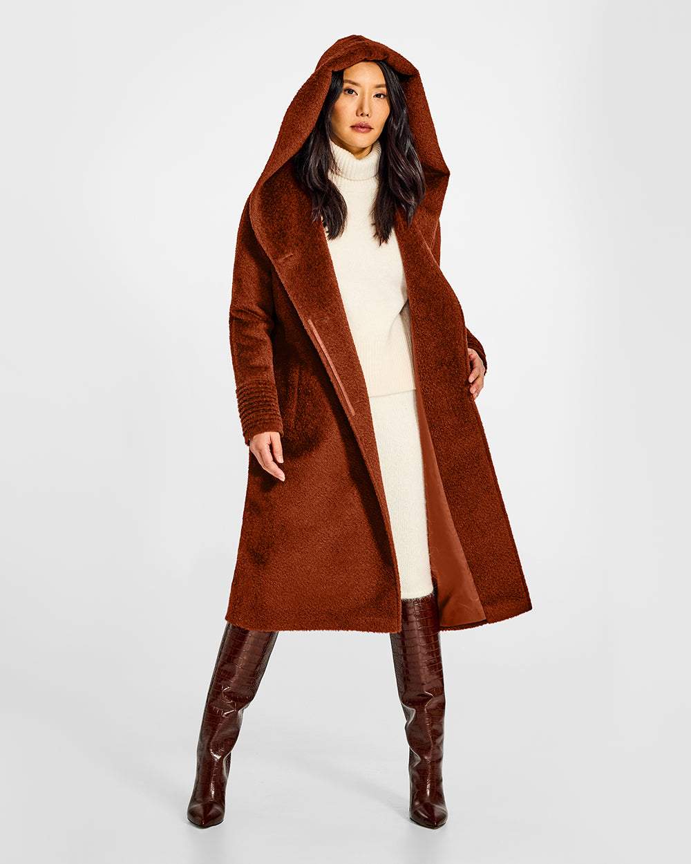 Sentaler Bouclé Alpaca Long Hooded Rust Coat in Bouclé Alpaca wool. Seen from front open with hood on female model.