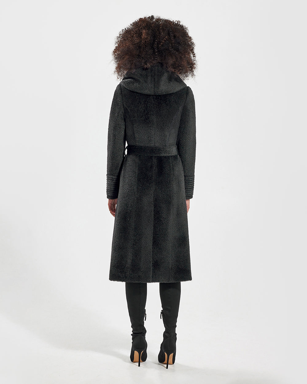 Sentaler Bouclé Alpaca Long Hooded Wrap Black Coat in Bouclé Alpaca wool. Seen from back belted on female model.