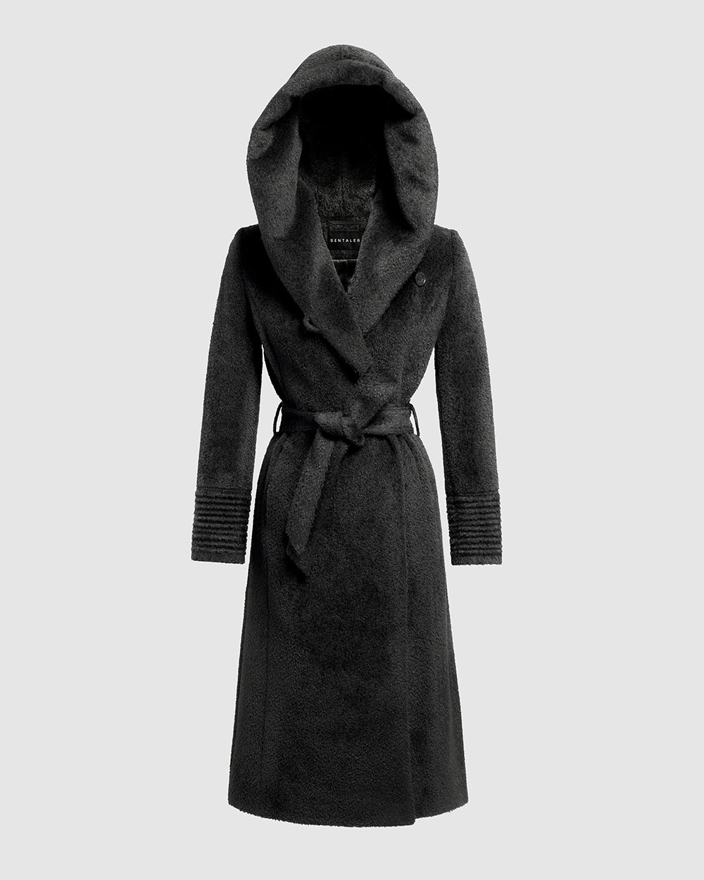 Sentaler Bouclé Alpaca Long Hooded Wrap Black Coat in Bouclé Alpaca wool. Seen as belted off figure with hood.