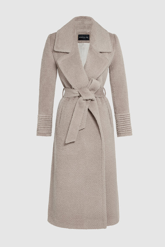 Sentaler Bouclé Alpaca Long Notched Collar Wrap Coat featured in Bouclé Alpaca and available in Sand Neutral. Seen as off figure belted.