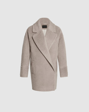 Sentaler mid length sand oversized coat made of bouclé alpaca wool with a notched collar, buttoned.