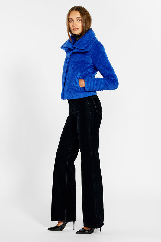Sentaler Bouclé Alpaca Moto Jacket with Signature Double Collar featured in Bouclé Alpaca and available in Cobalt Blue. Seen from side on female model.