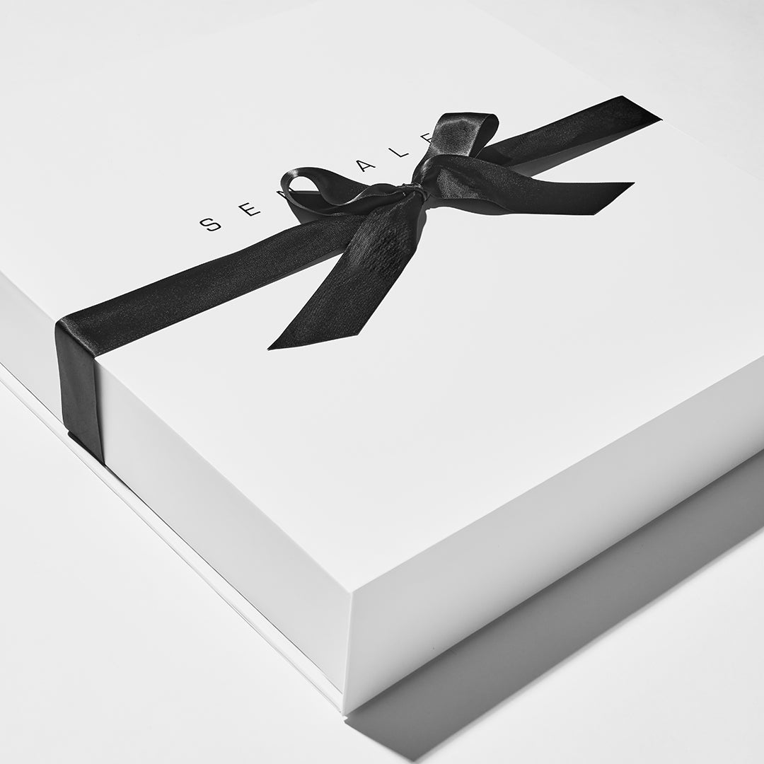 SENTALER classic white gift box finished with a tied black ribbon.