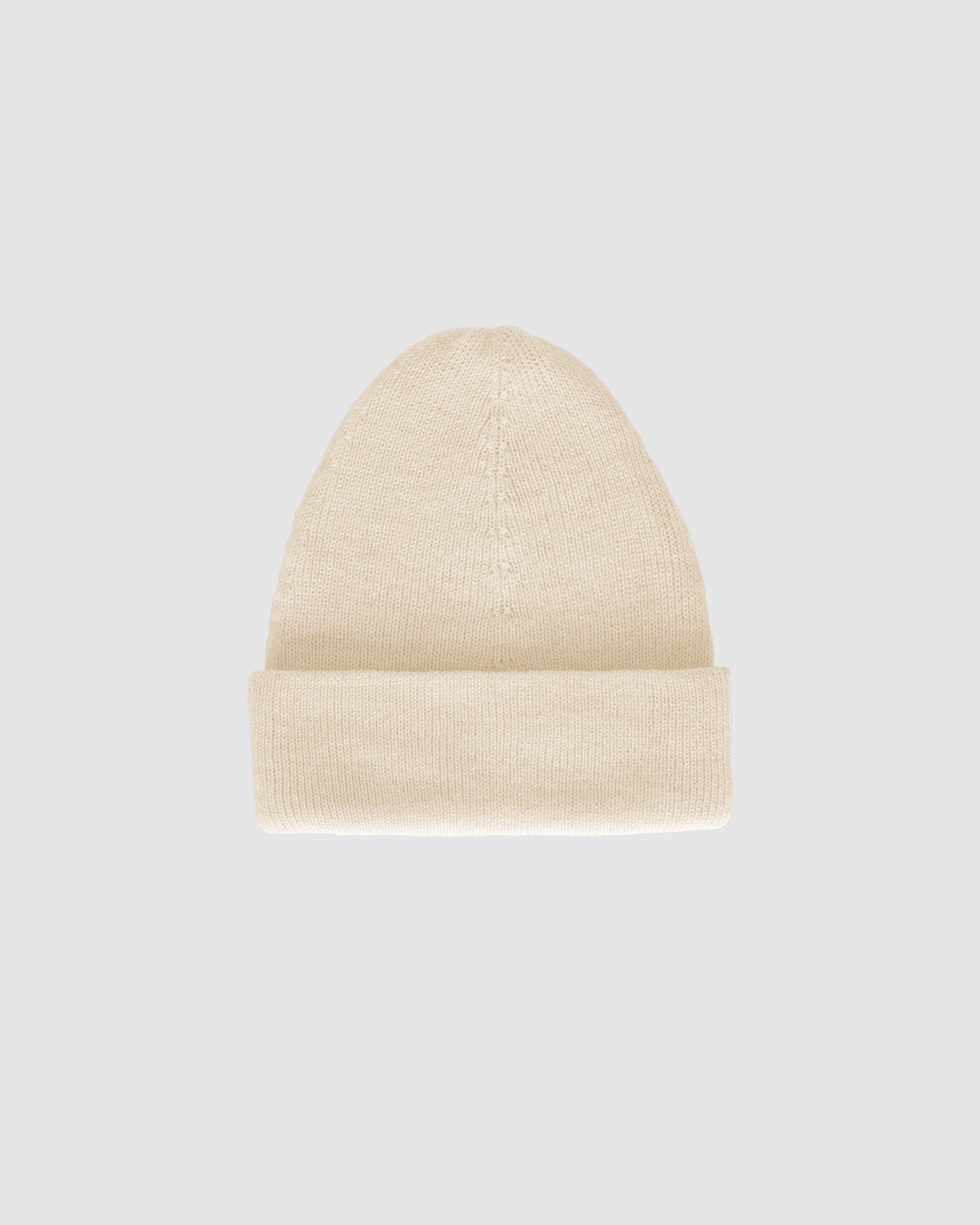 Sentaler classic ivory beanie made from baby alpaca yarn, displayed on a white background.