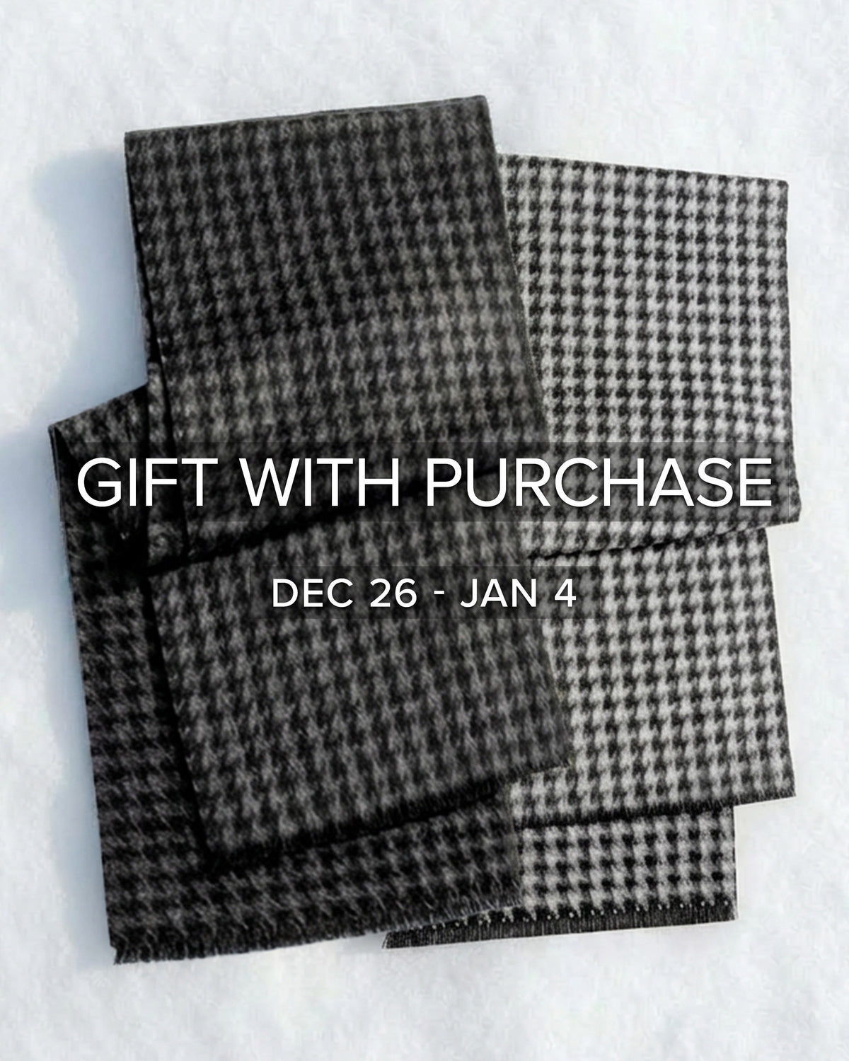 Sentaler women’s Black & White Houndstooth & Black & Graphite Houndstooth scarves made of Baby Alpaca fabric, displayed on a white background.