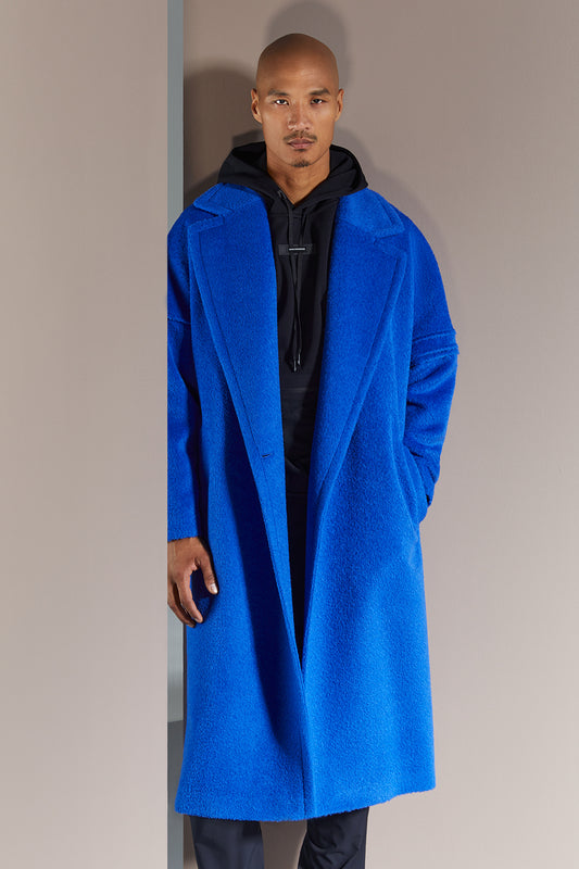 Sentaler Technical Bouclé Alpaca Robe Coat crafted in Technical Bouclé Alpaca and in Cobalt Blue. Seen from front open on male model.