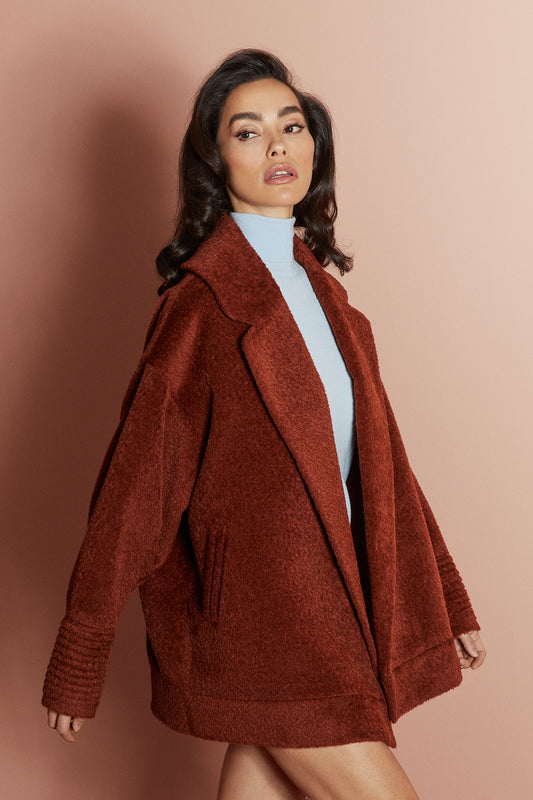 Model wearing rust aviator jacket