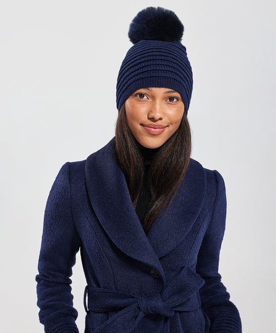 Sentaler Adult Ribbed Hat With Oversized Fur Pompon crafted in Baby Alpaca and in Navy Blue. Seen from front on female model close up.