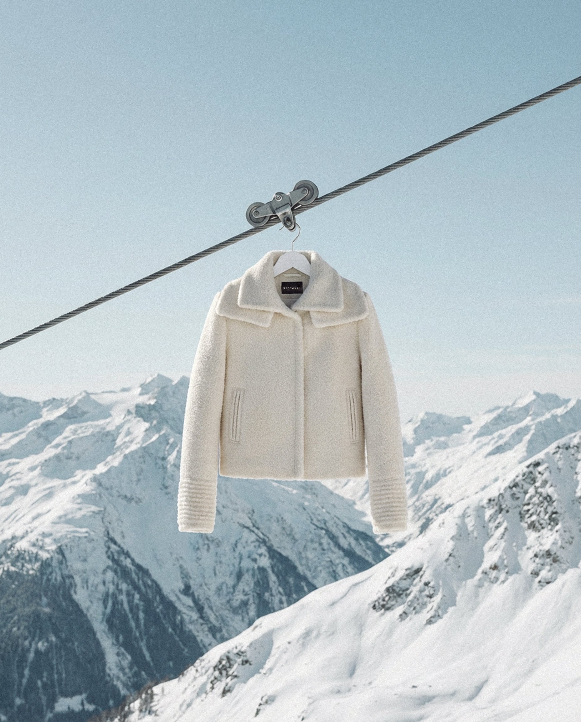 Sentaler ivory moto jacket made of bouclé alpaca wool with a double collar, buttoned.