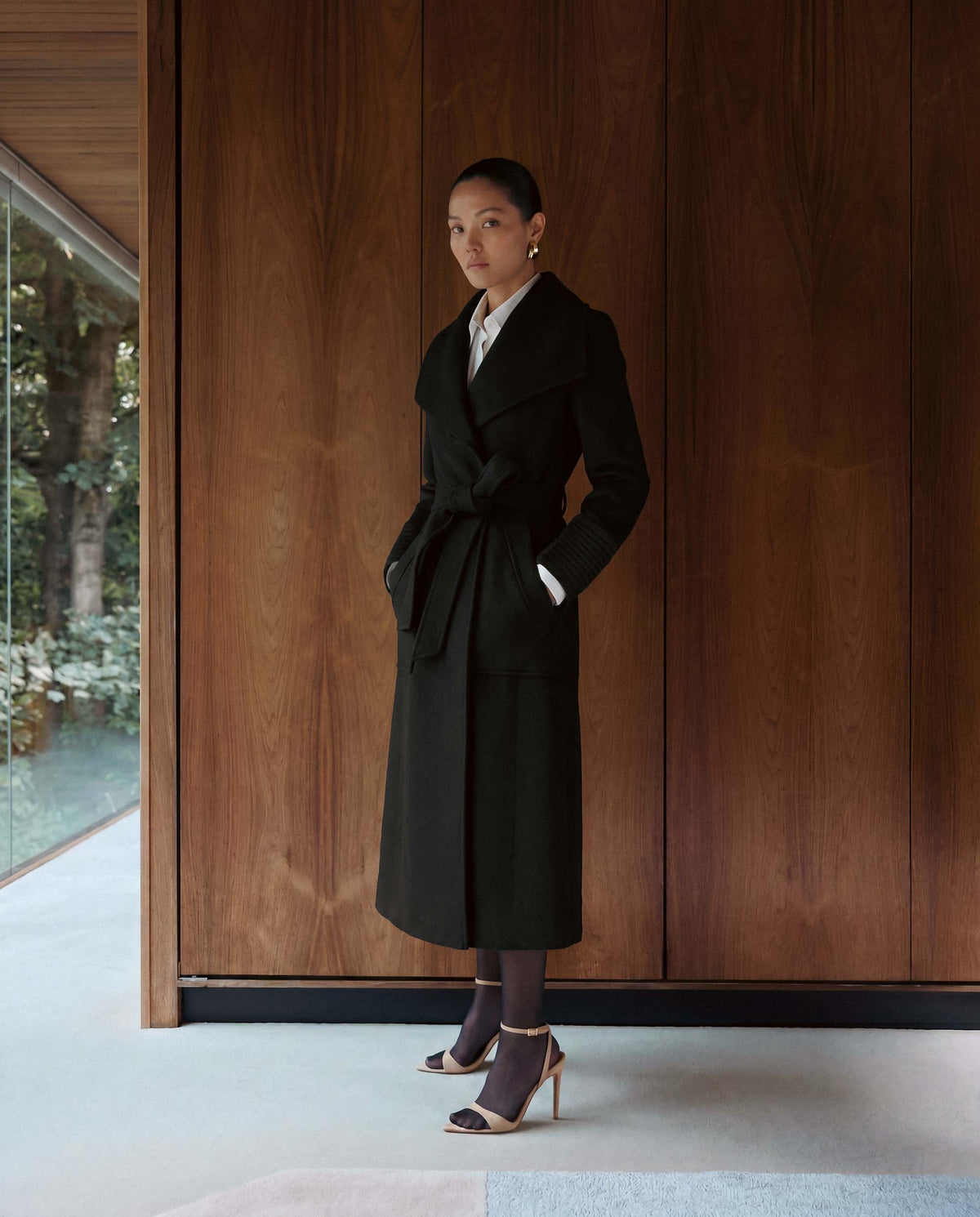 SENTALER Long Wide Collar Wrap Coat in Black, Baby Alpaca — worn by a female model, front view, belted.