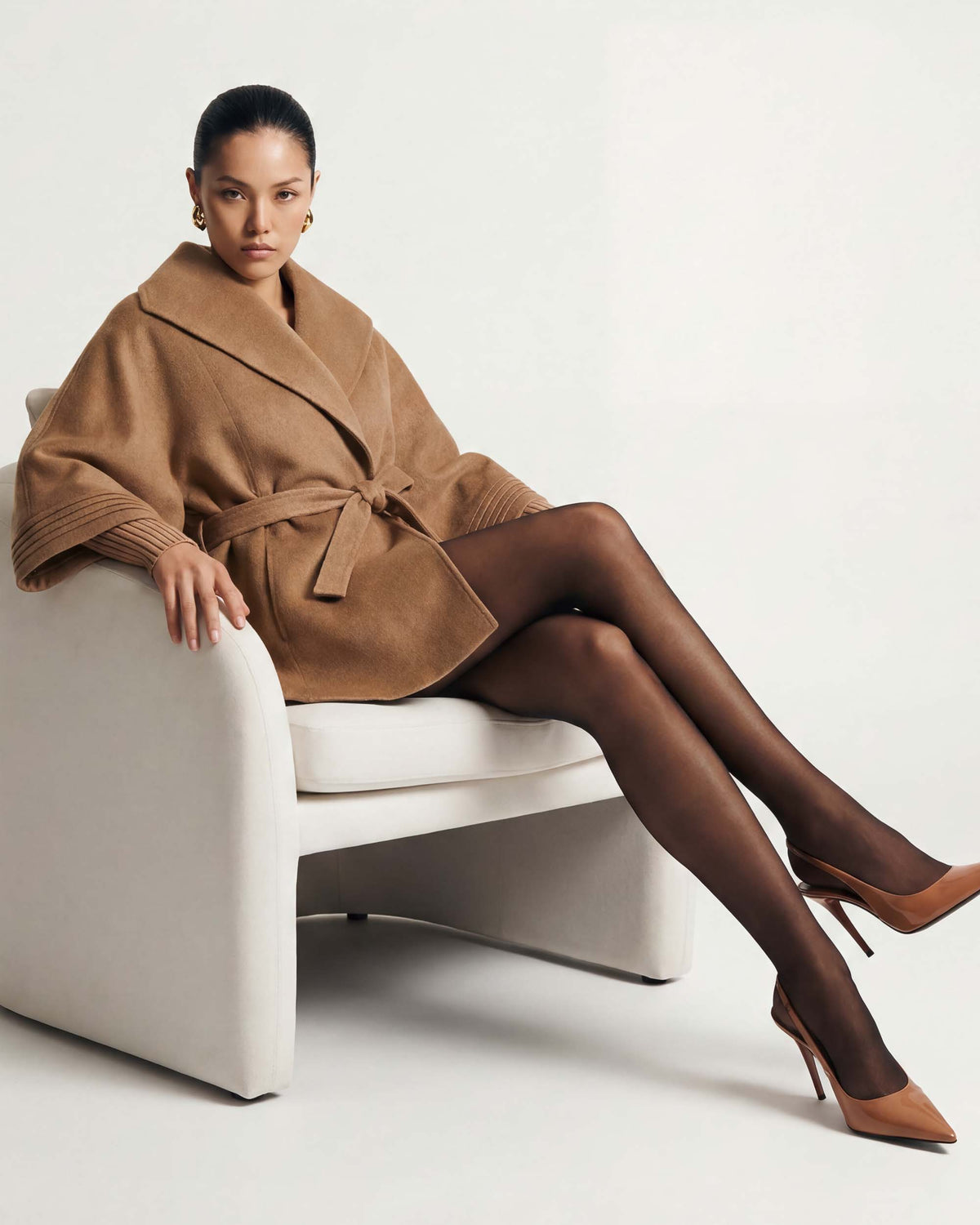 SENTALER Cape with Shawl Collar and Belt in Dark Camel, Baby Alpaca — worn by a female model, front view, belted.