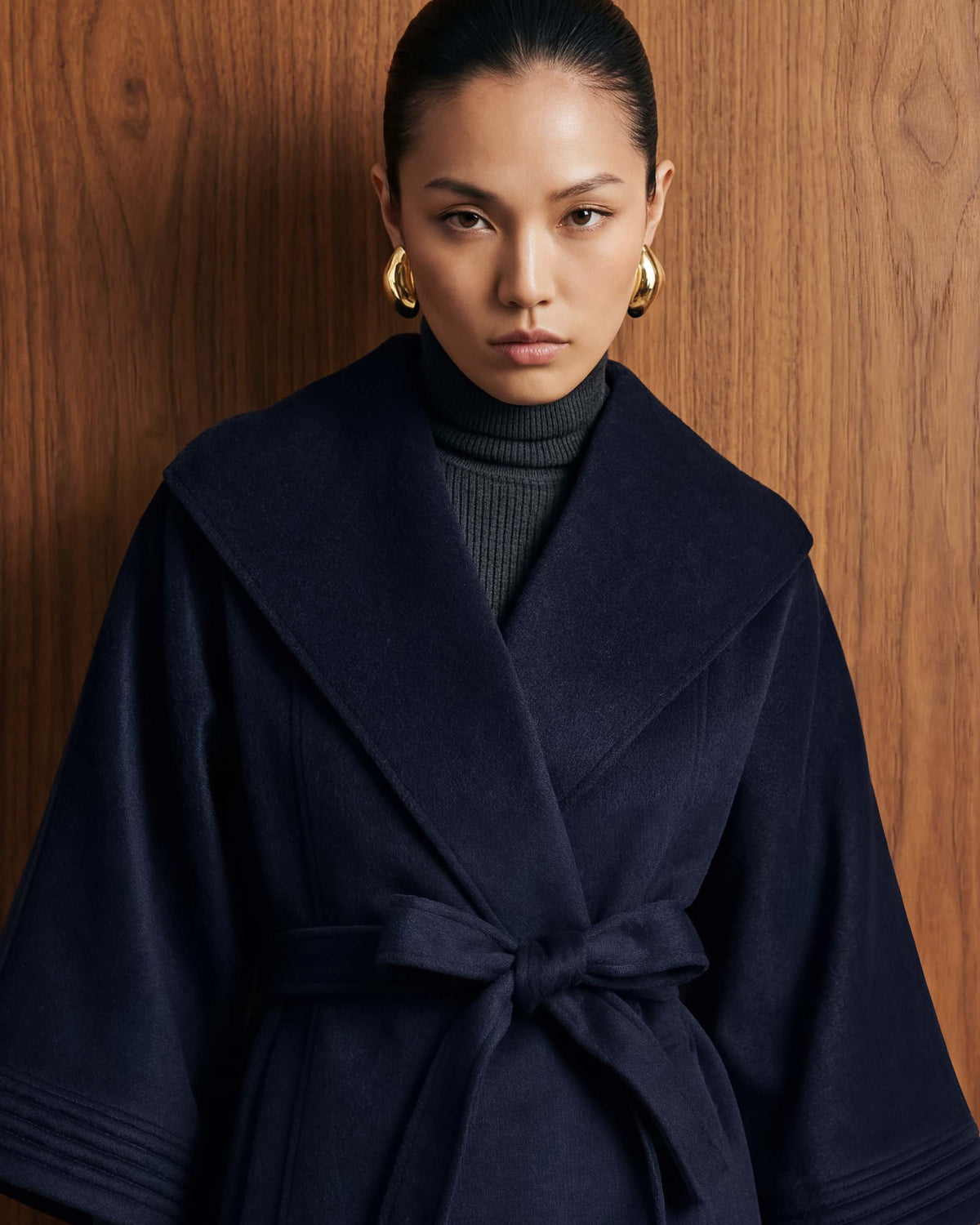 SENTALER Cape with Shawl Collar and Belt in Deep Navy, Baby Alpaca — worn by a female model, front view, belted.