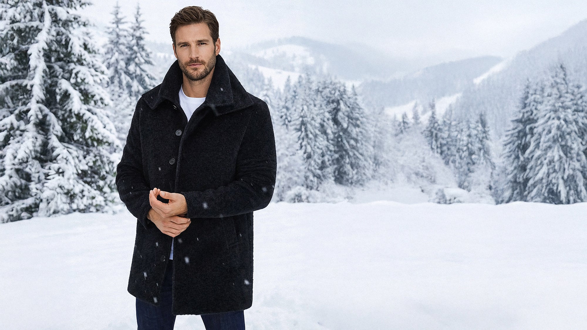 Sentaler Notched Lapel Black Overcoat in Baby Alpaca wool. Seen buttoned.