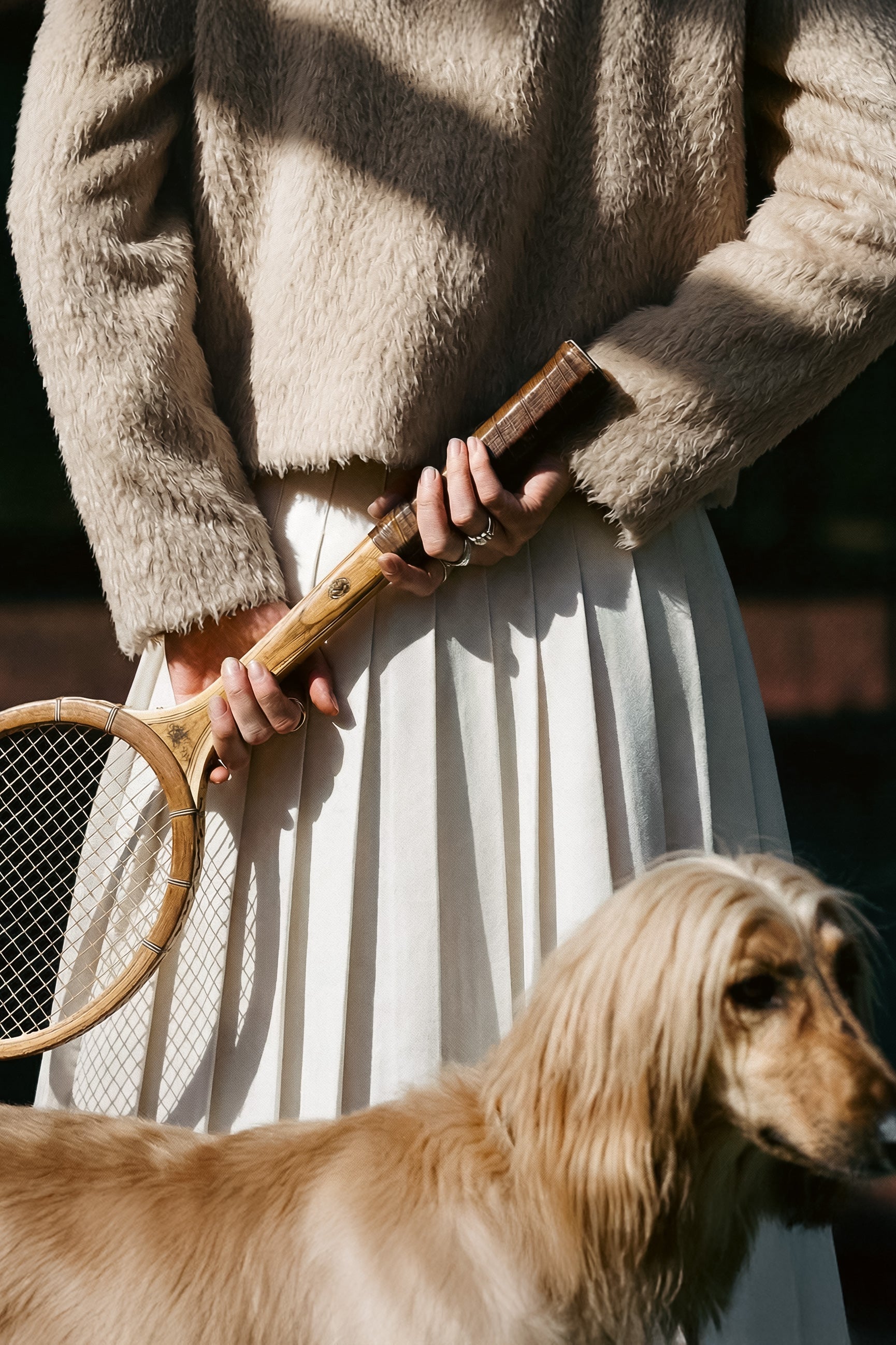  Back close up view of model wearing a Sentaler moto oat jacket made of textured suri alpaca wool, worn buttoned.