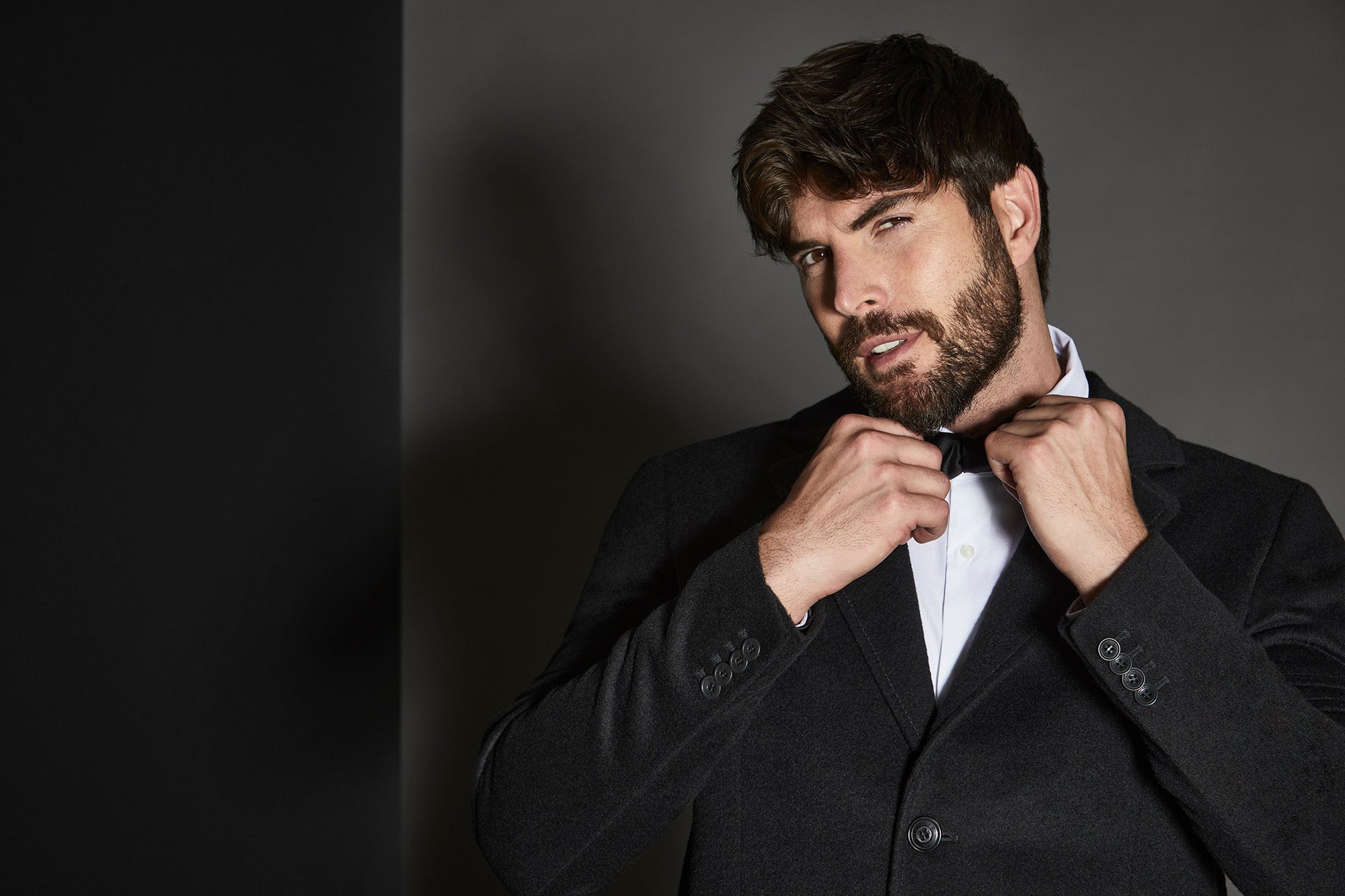 Sentaler Notched Lapel Black Overcoat in Baby Alpaca wool. Seen open.