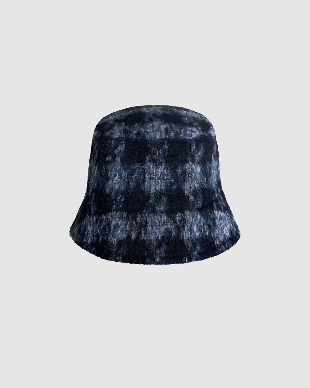 Sentaler Suri Alpaca Bucket Navy Houndstooth Hat in Suri Alpaca wool. Seen as off figure.