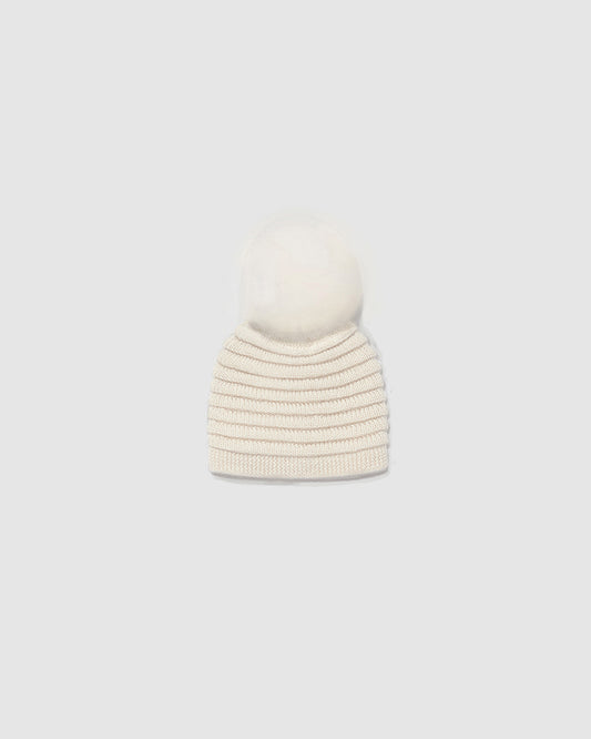 Sentaler Kids Ribbed Ivory Hat with Fur Pompon (4-5 Years) in Baby Alpaca yarn. Seen as off figure.