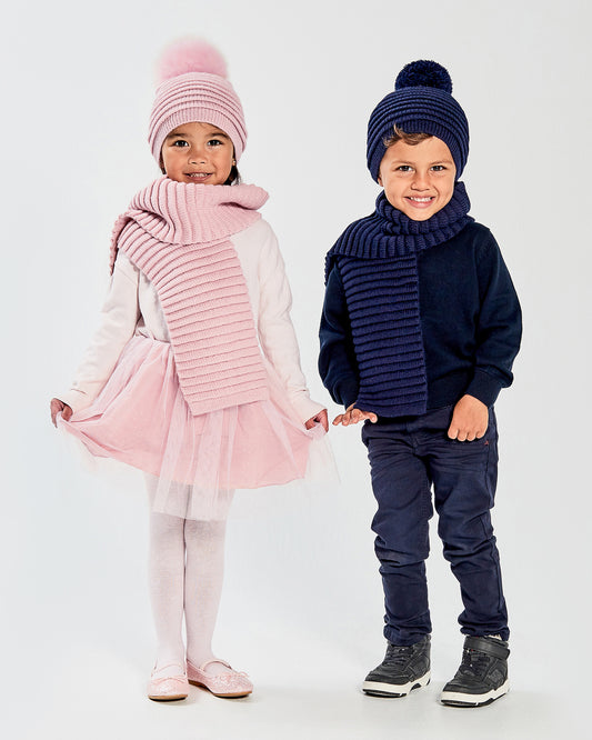 Sentaler Kids Ribbed Navy Scarf & Pompon Hat (1-5 Years) in Baby Alpaca yarn. Seen from front on boy model.