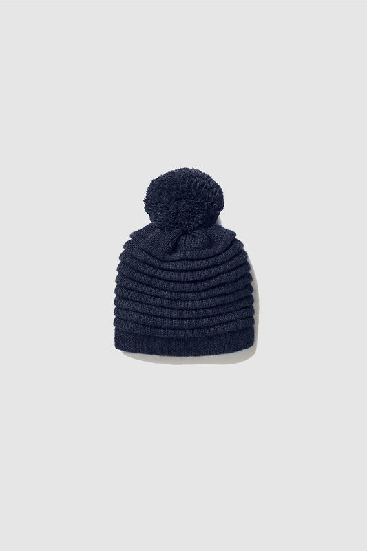 Sentaler Kids (1-5 Years) Ribbed Hat with Oversized Knit Pompon featured in Baby Alpaca and available in Navy Blue. Seen as off figure.
