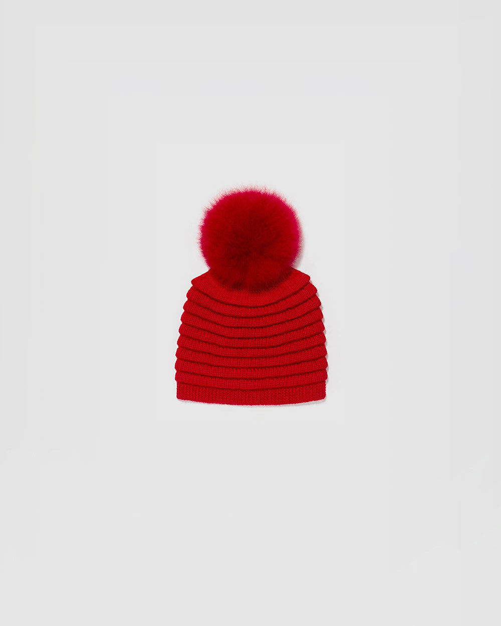 Sentaler Kids Ribbed Red Hat with Fur Pompon (4-5 Years) in Baby Alpaca yarn. Seen as off figure.