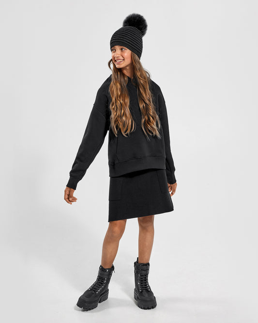 Sentaler Kids Ribbed Grey Hat with Fur Pompon (6-14 Years) in Baby Alpaca yarn. Seen from front on girl model.