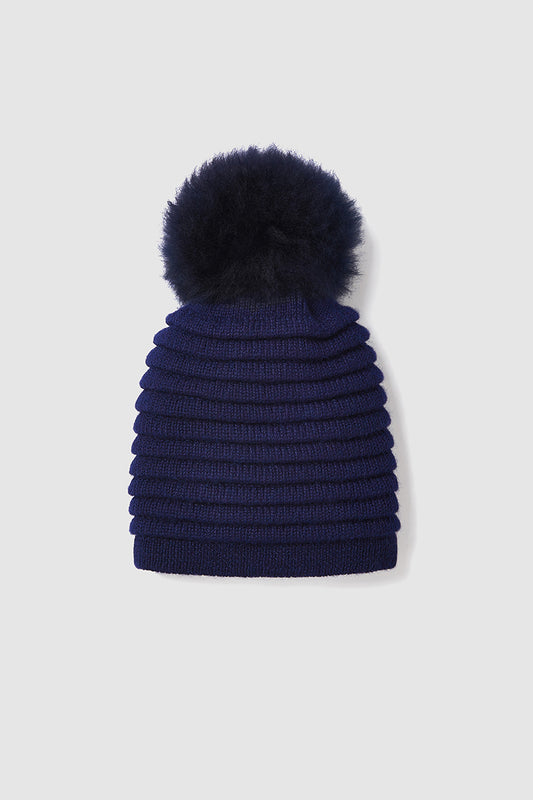 Sentaler Kids (6-14 Years) Ribbed Hat with Oversized Fur Pompon crafted in Baby Alpaca and in Navy Blue. Seen as off figure.