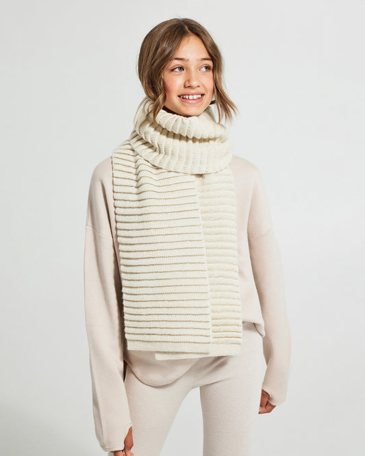 Sentaler Kids Ribbed Ivory Scarf (6-14 Years) in Baby Alpaca yarn. Seen from front close up on girl model.