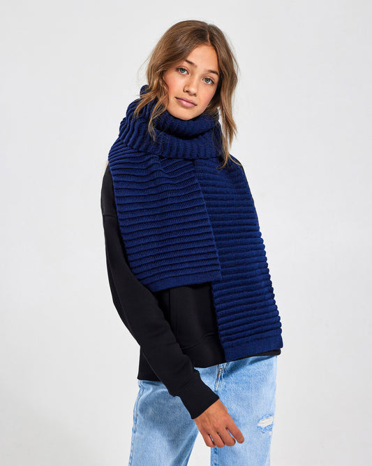 Sentaler Kids Ribbed Navy Scarf (6-14 Years) in Baby Alpaca yarn. Seen from front on girl model.