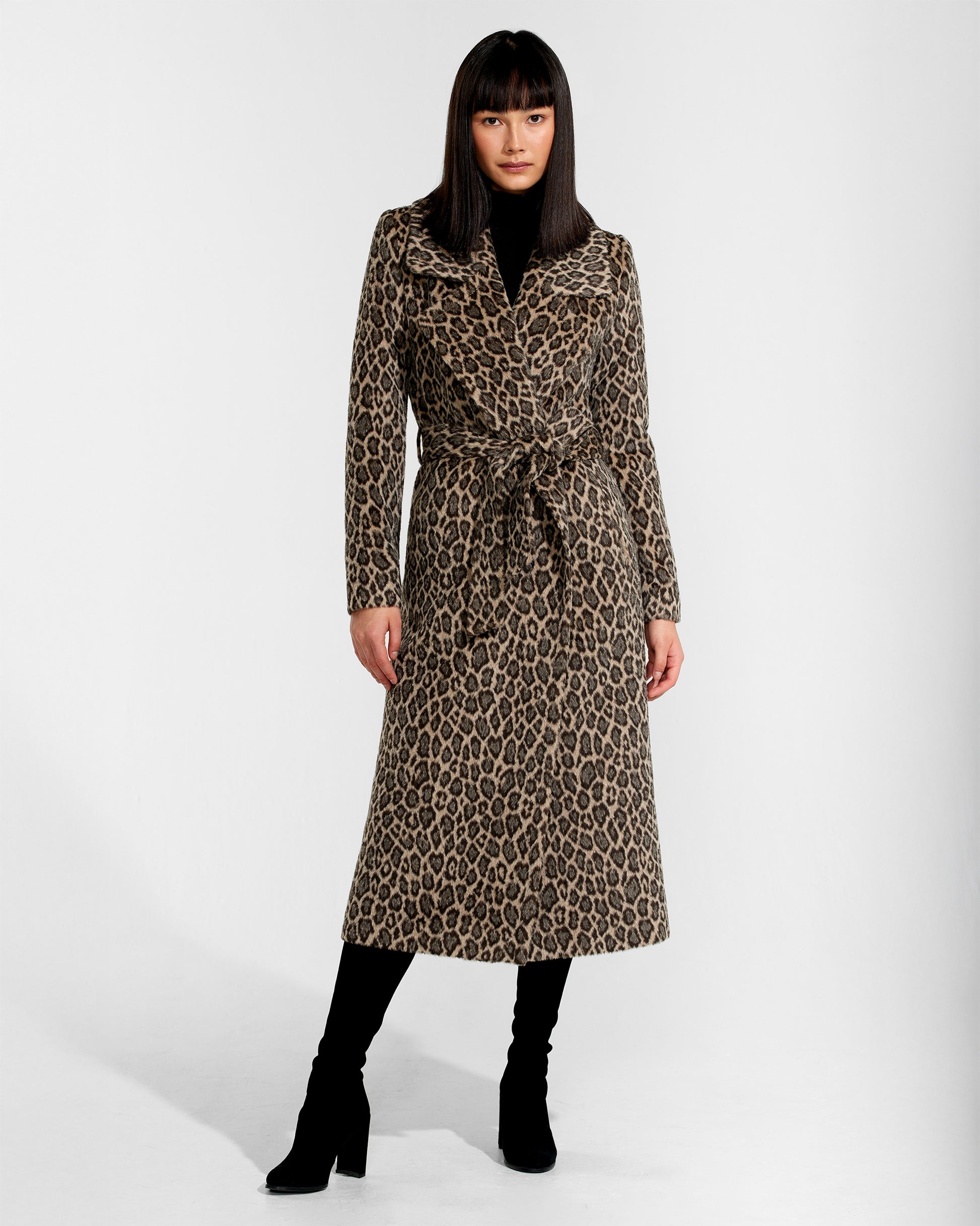 Front view of model wearing a Sentaler leopard wrap coat made of bouclé alpaca wool, with a notched collar, worn belted.