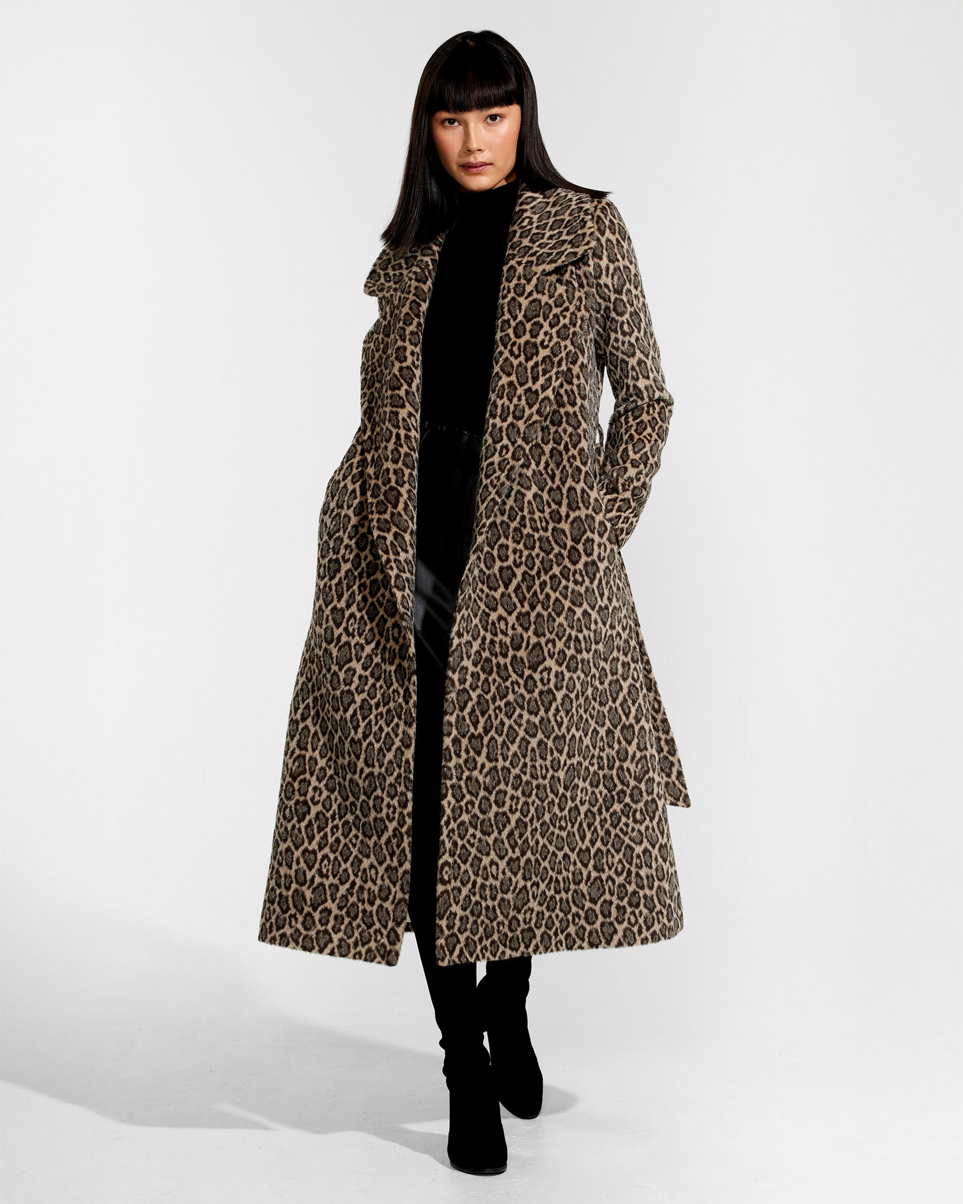 Front view of model wearing a Sentaler leopard wrap coat made of bouclé alpaca wool, with a notched collar, worn open.