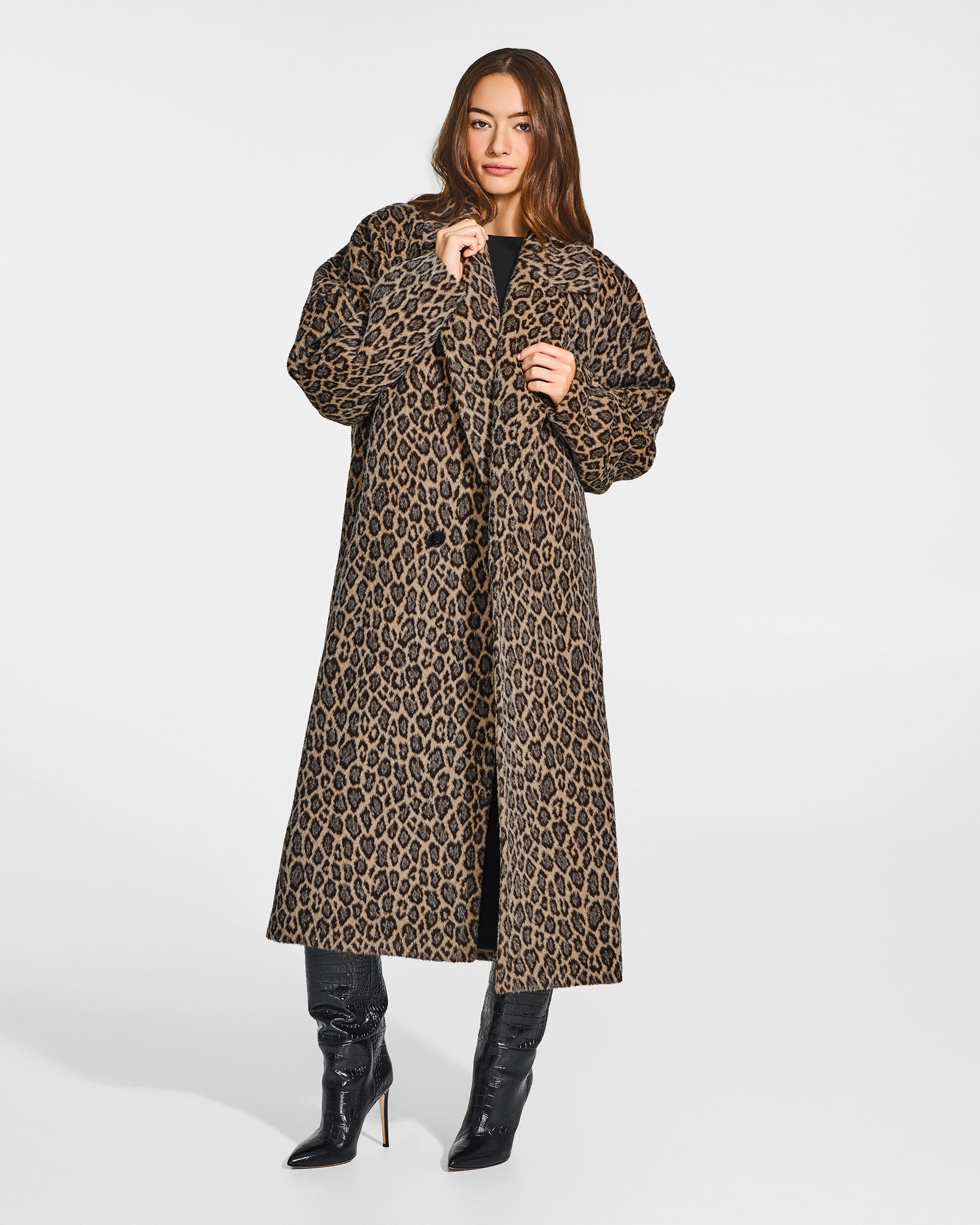 Front view of model wearing a Sentaler long leopard robe coat made of bouclé suri alpaca wool, with long notched collar, worn open.