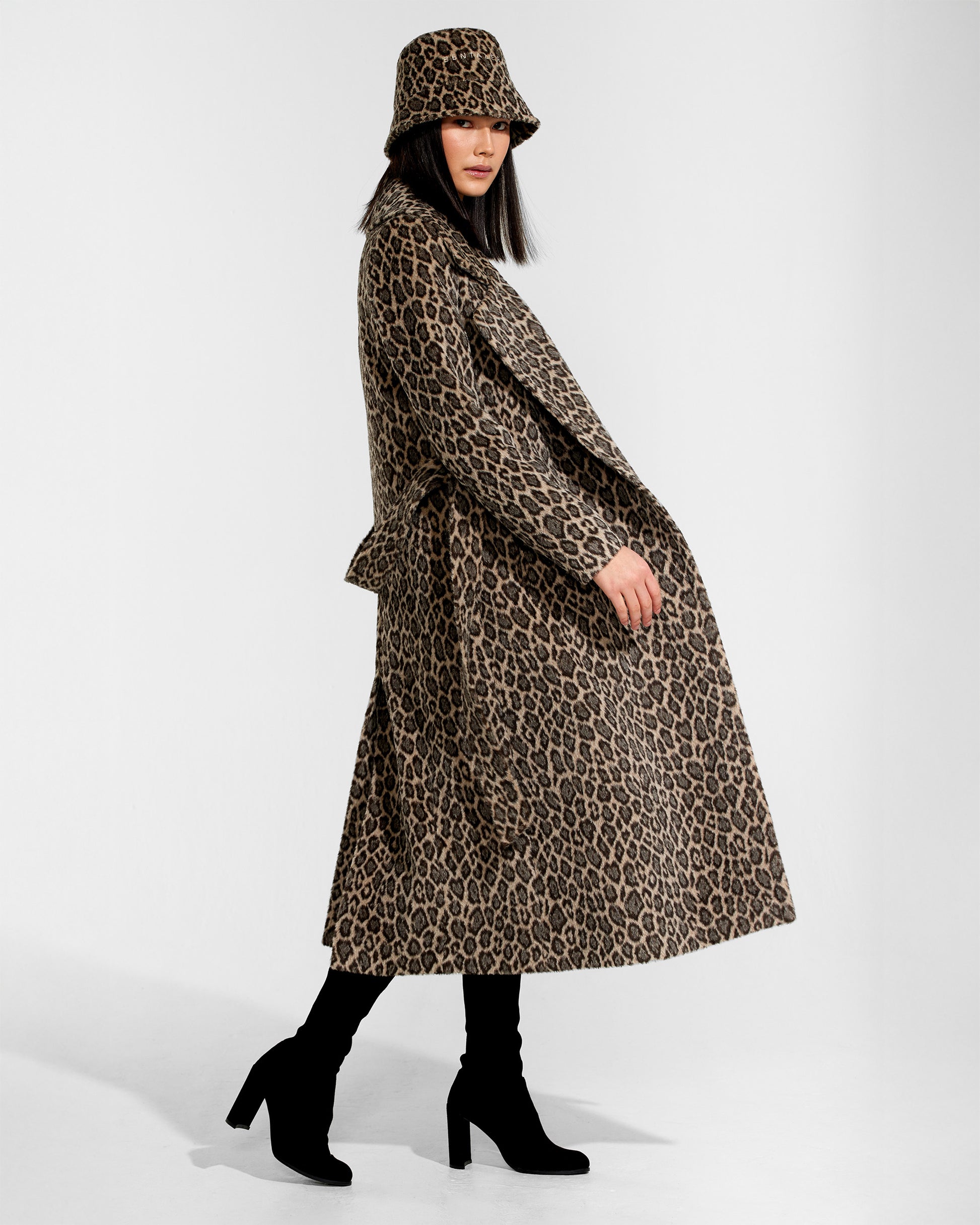 Sentaler Bouclé Alpaca Bucket Leopard Hat in Bouclé Alpaca wool. Seen from side on female model.