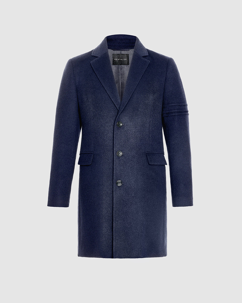 Sentaler deep navy overcoat made of baby alpaca wool with a notched lapel, buttoned.