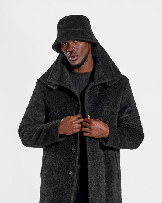 Sentaler Mens Bouclé Alpaca Bucket Black Hat in Bouclé Alpaca. Seen from front close up on male model.