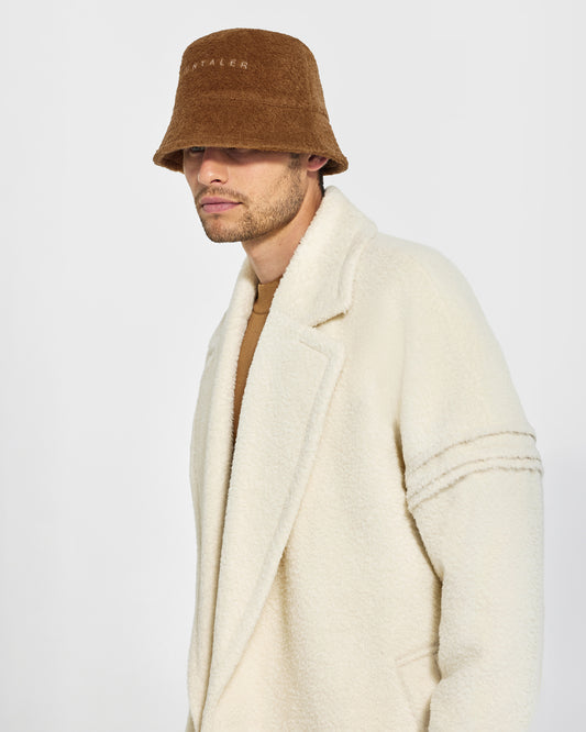 Sentaler Mens Bouclé Alpaca Bucket Caramel Café Hat in Bouclé Alpaca. Seen from side close up on male model.