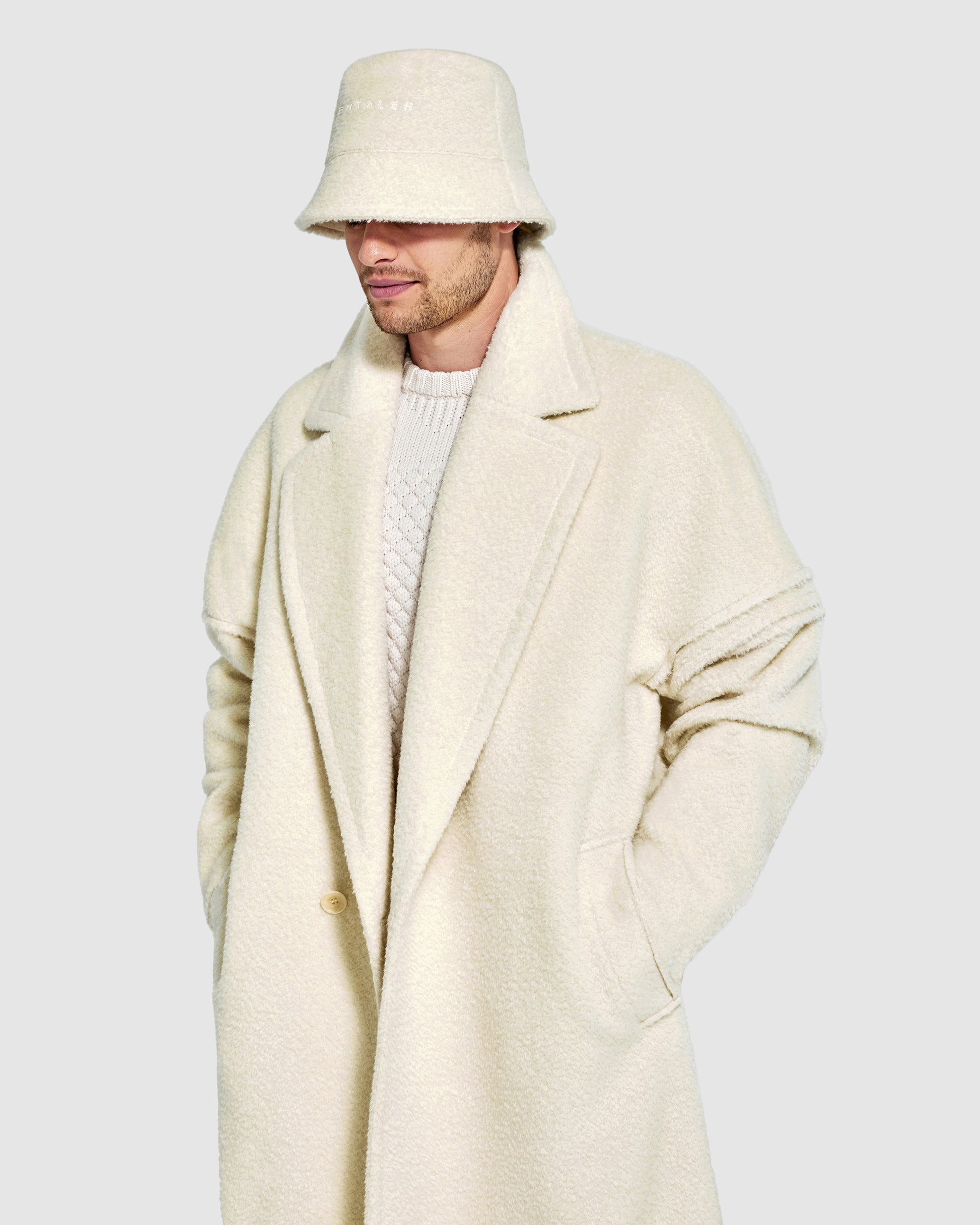 Sentaler Mens Bouclé Alpaca Bucket Ivory Hat in Bouclé Alpaca. Seen from front close up on male model.