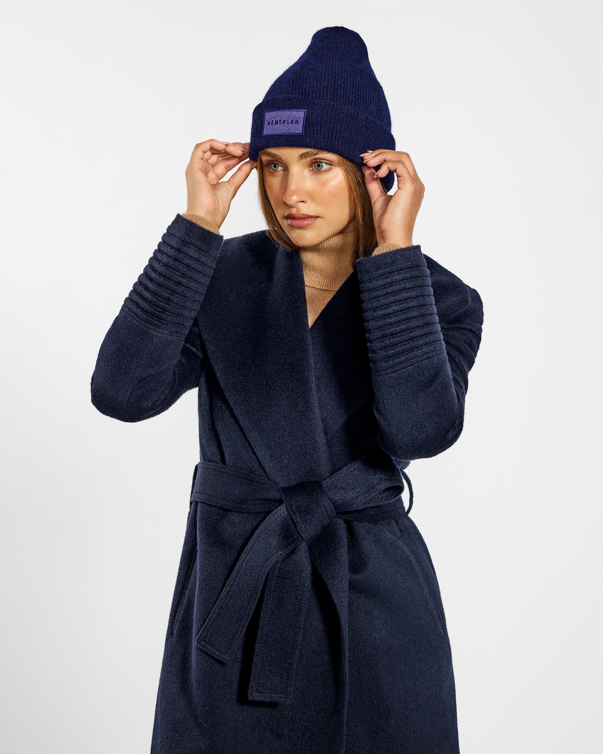 Sentaler Alpaca Navy Beanie in Baby Alpaca yarn. Seen from front close up on female model.